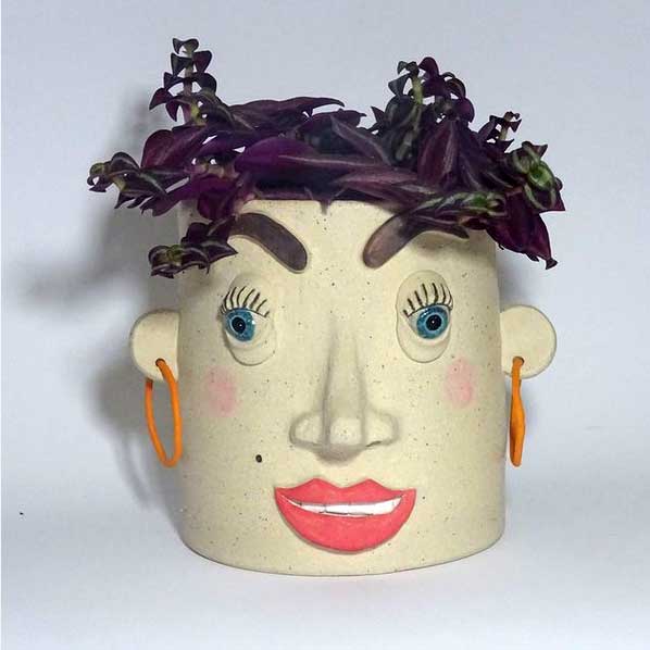 Estelle Pothead by Emily Jane Ceramics, shown with Senecio radicans as hair.